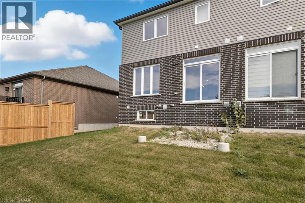 Rear view of house with brick siding - 256 Keeso Lane, Listowel, ON - Outdoor