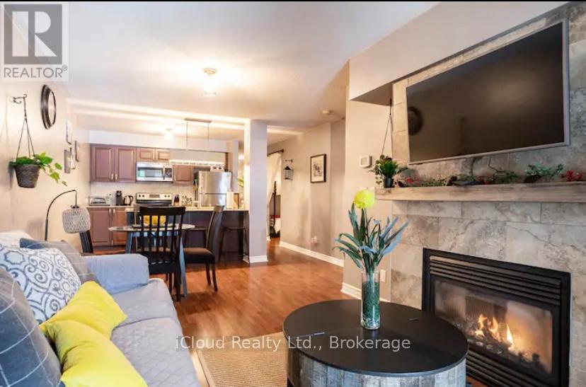 104 - 1 Brandy Lane Drive, Collingwood, ON - Indoor Photo Showing Living Room With Fireplace