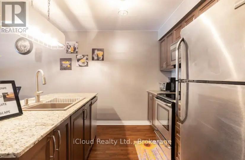 104 - 1 Brandy Lane Drive, Collingwood, ON - Indoor Photo Showing Kitchen With Double Sink
