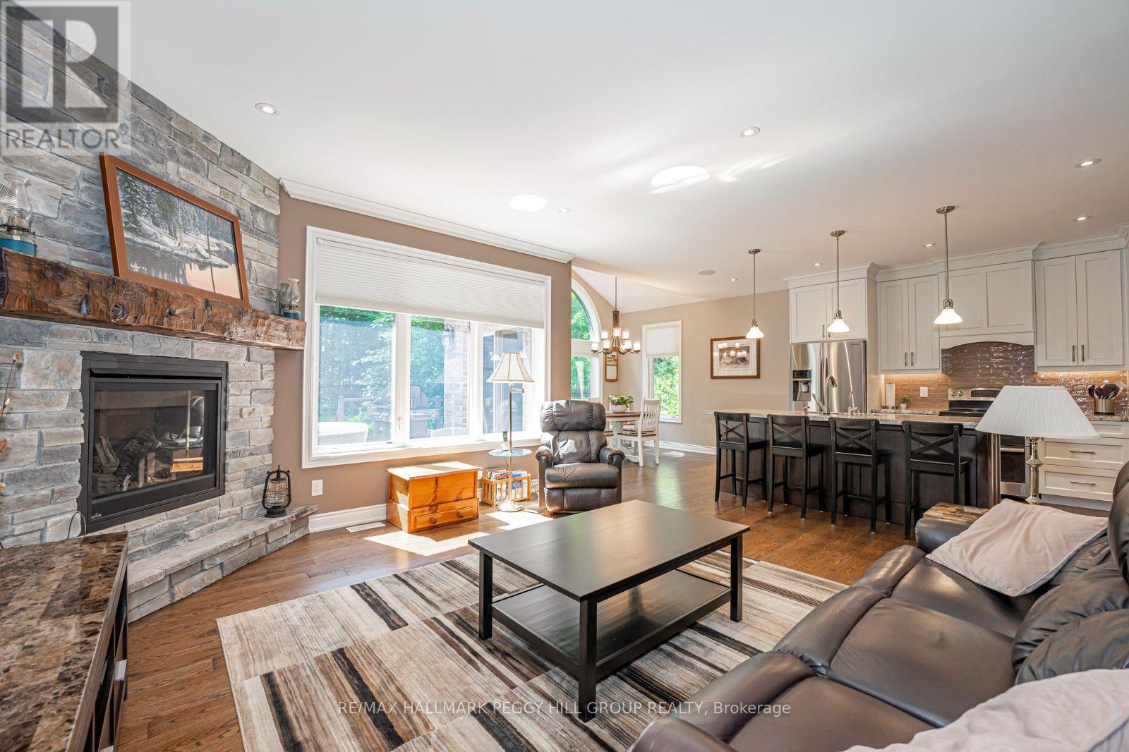 126 Mennill Drive, Springwater, ON - Indoor Photo Showing Living Room With Fireplace