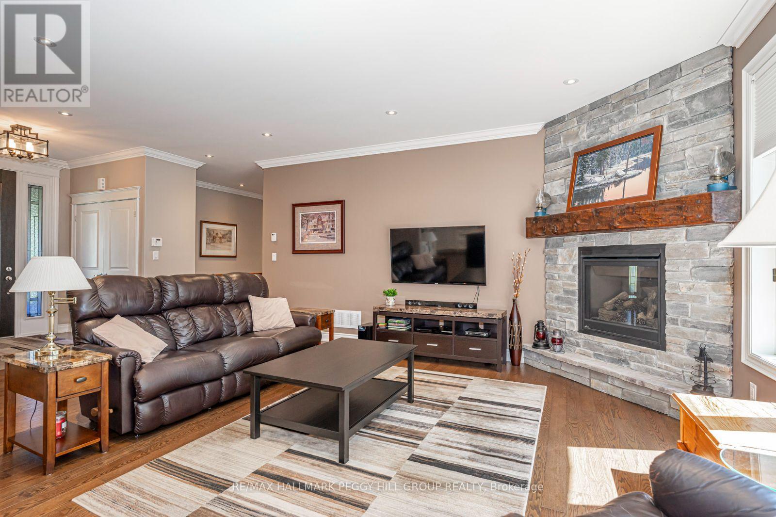 126 Mennill Drive, Springwater, ON - Indoor Photo Showing Living Room With Fireplace