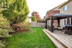 Low maintenance yard offers shade and privacy -