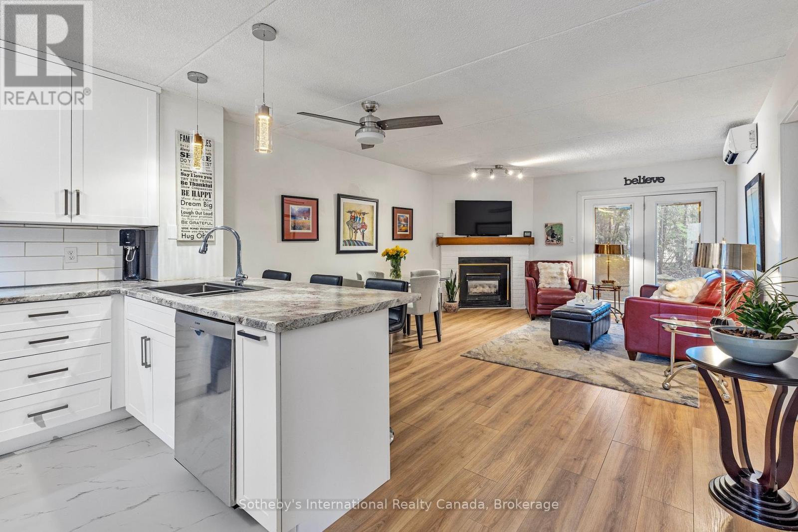 181 - 49 Trott Boulevard, Collingwood, ON - Indoor Photo Showing Kitchen With Fireplace With Double Sink