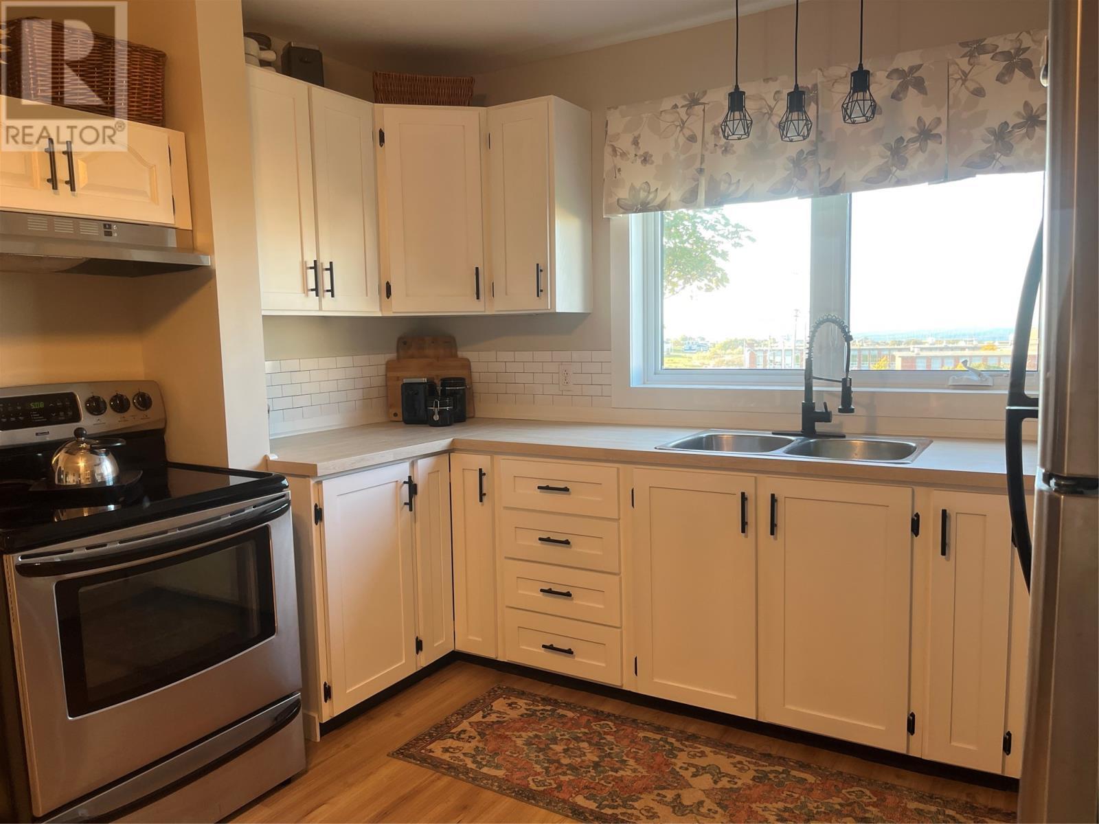 5 Post Office Road, Bell Island, NL - Indoor Photo Showing Kitchen With Double Sink
