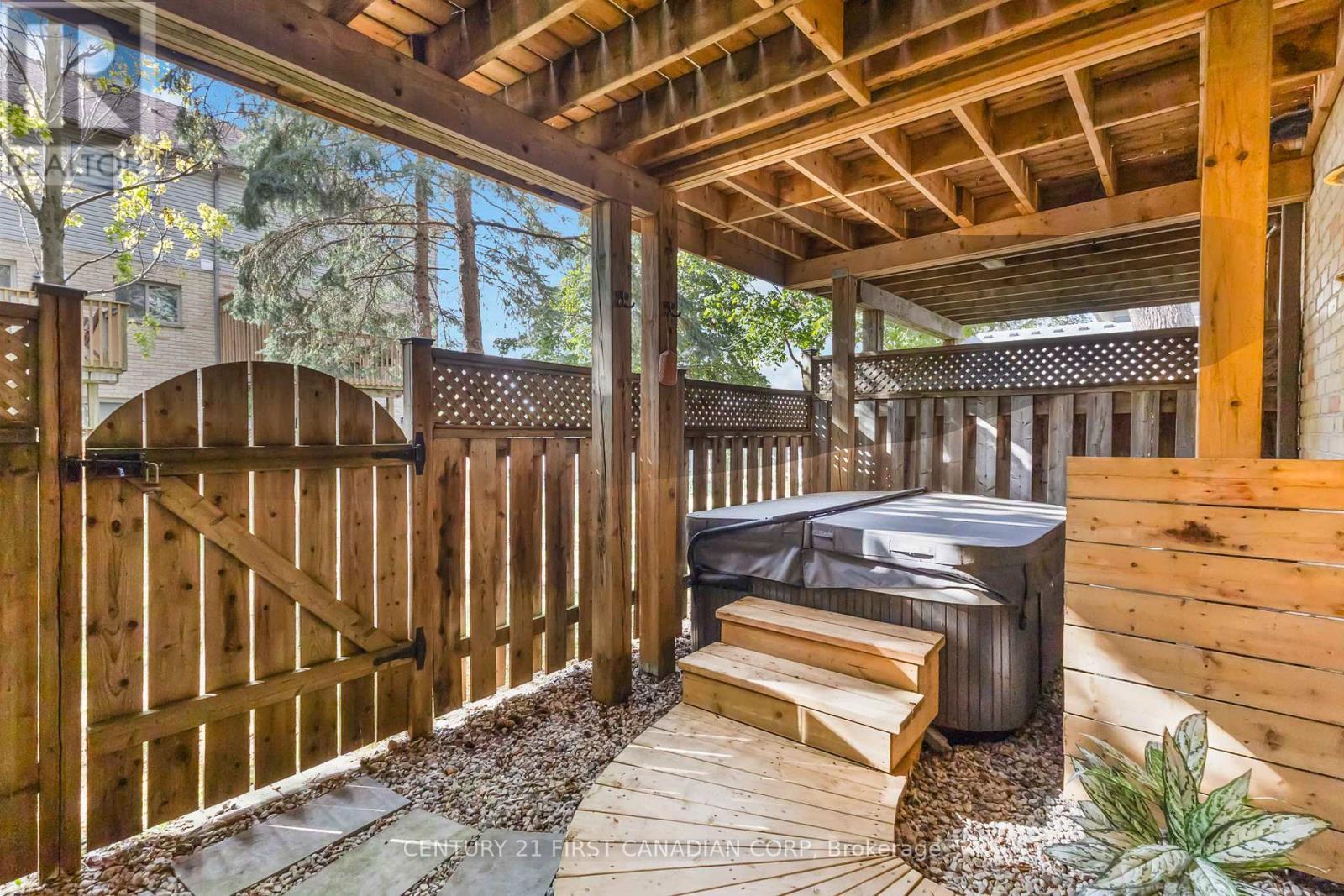 Fenced in patio with hot tub - 4 - 609 Colborne Street E, London East (East F), ON - With Deck Patio Veranda With Exterior
