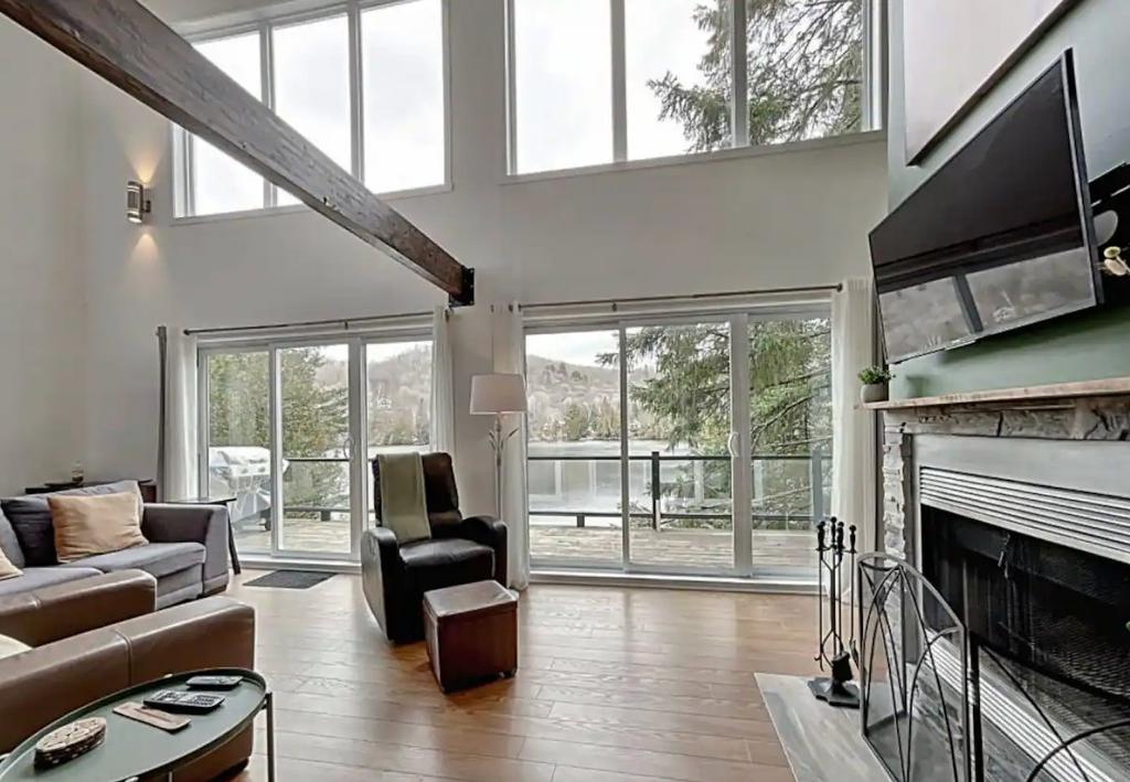 Living room - 2705 Route 323 N., Amherst, QC - Indoor Photo Showing Living Room With Fireplace