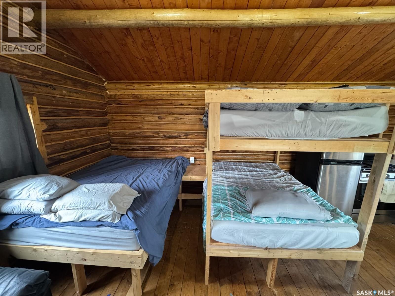 Cabin On Island Near Mooney Beach, Lac La Ronge Provincial Park, SK - Indoor Photo Showing Bedroom