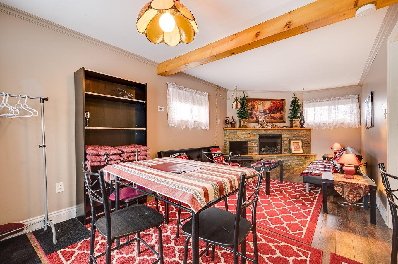 Salon - 330A Rue De L'Edelweiss, Sainte-Agathe-Des-Monts, QC - Indoor With Fireplace