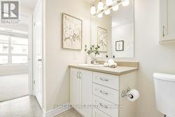 Ensuite laundry tucked away behind door -