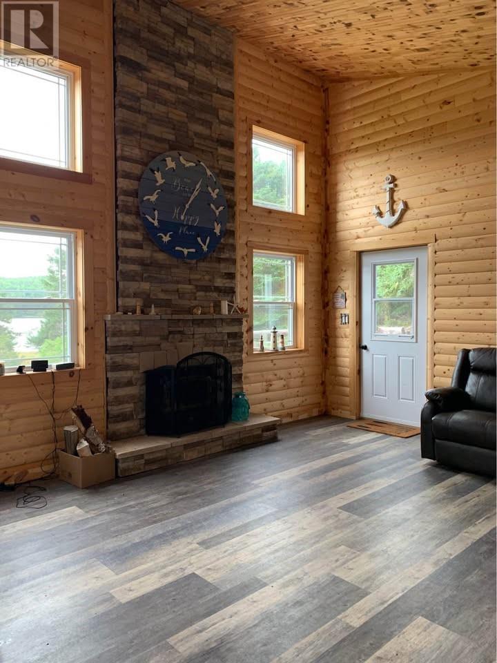 1 Julie'S Harbour Other, Badger Bay, NL - Indoor Photo Showing Living Room With Fireplace