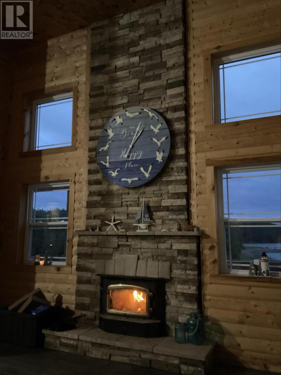 1 Julie'S Harbour Other, Badger Bay, NL - Indoor Photo Showing Living Room With Fireplace