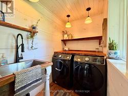 Stunning finishes in main floor laundry room. -