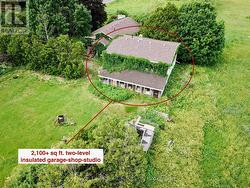 Detached two level garage-shop with living space. -