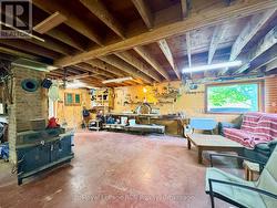 35.And shop area with work bench & storage wall. -