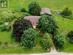 Home is surrounded by trees & greenery. -