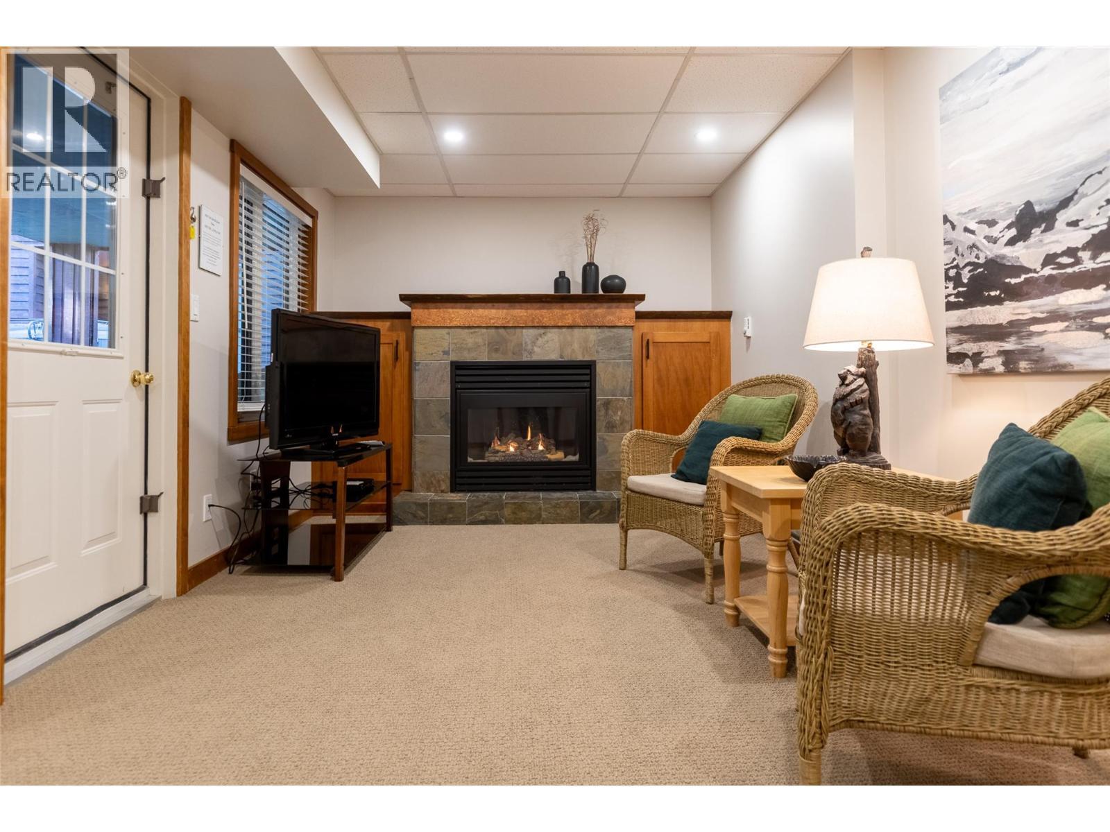4576 Timberline Crescent Unit# 4, Fernie, BC - Indoor Photo Showing Other Room With Fireplace