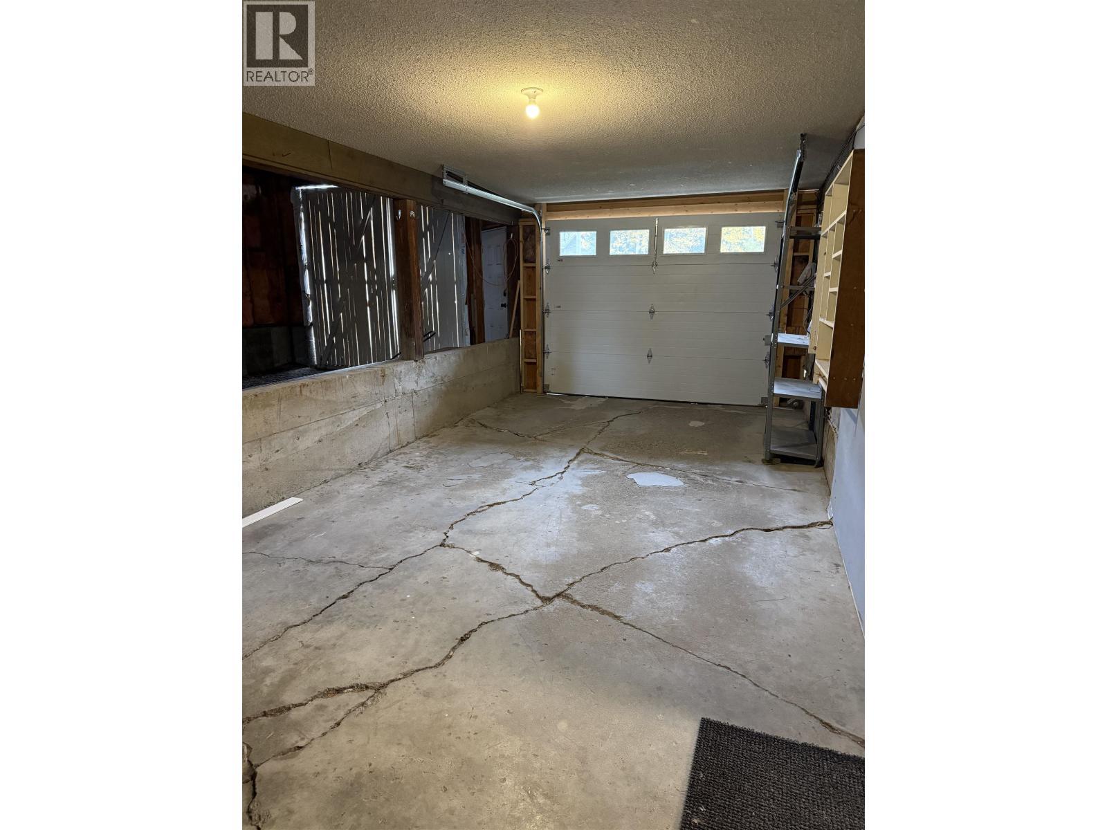 835 Spruce Avenue, 100 Mile House, BC - Indoor Photo Showing Garage