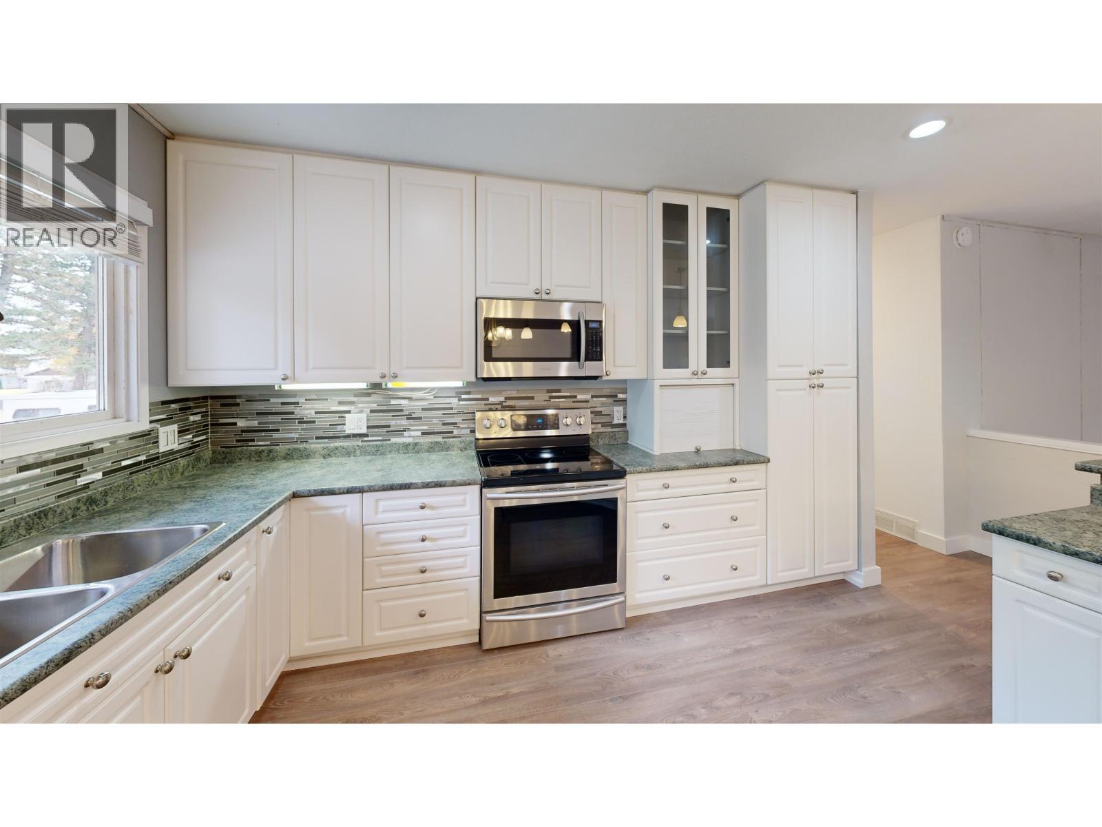 835 Spruce Avenue, 100 Mile House, BC - Indoor Photo Showing Kitchen With Double Sink