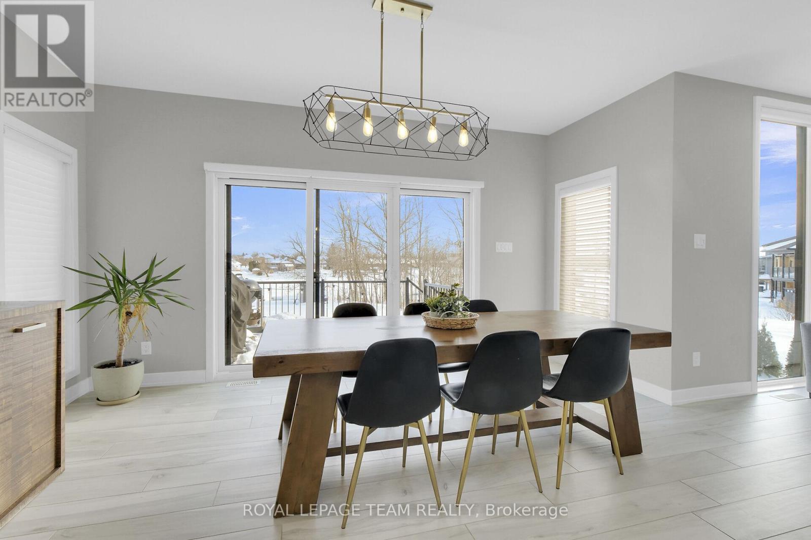 Patio doors lead to rear deck overlooking backyard - 504 Barrage Street, Casselman, ON - Indoor Photo Showing Dining Room