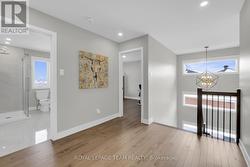 Hardwood open stairs lead to 2nd level. -