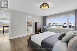 Hardwood floors & large window in Primary BR. -