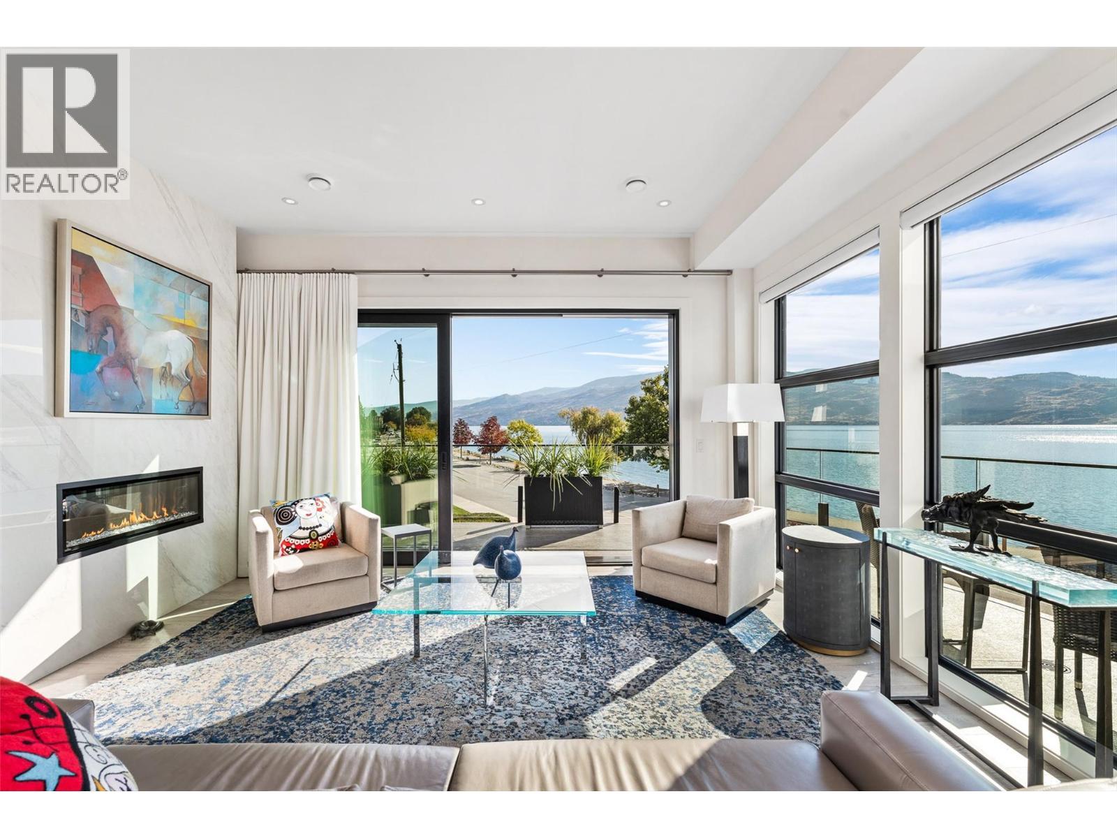 4364 Beach Avenue Unit# 1, Peachland, BC - Indoor Photo Showing Living Room With Fireplace
