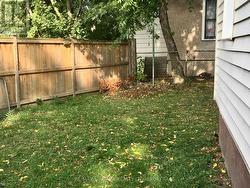 A Yard in the middle of Downtown! Wraps around -