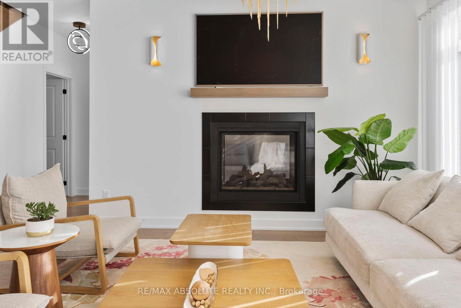 2 sided fireplace shared with the library - 921 Beckton Heights, Ottawa, ON - Indoor Photo Showing Living Room With Fireplace