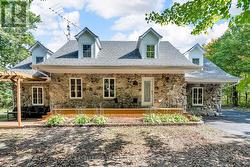 Porch to enjoy treed front yard -