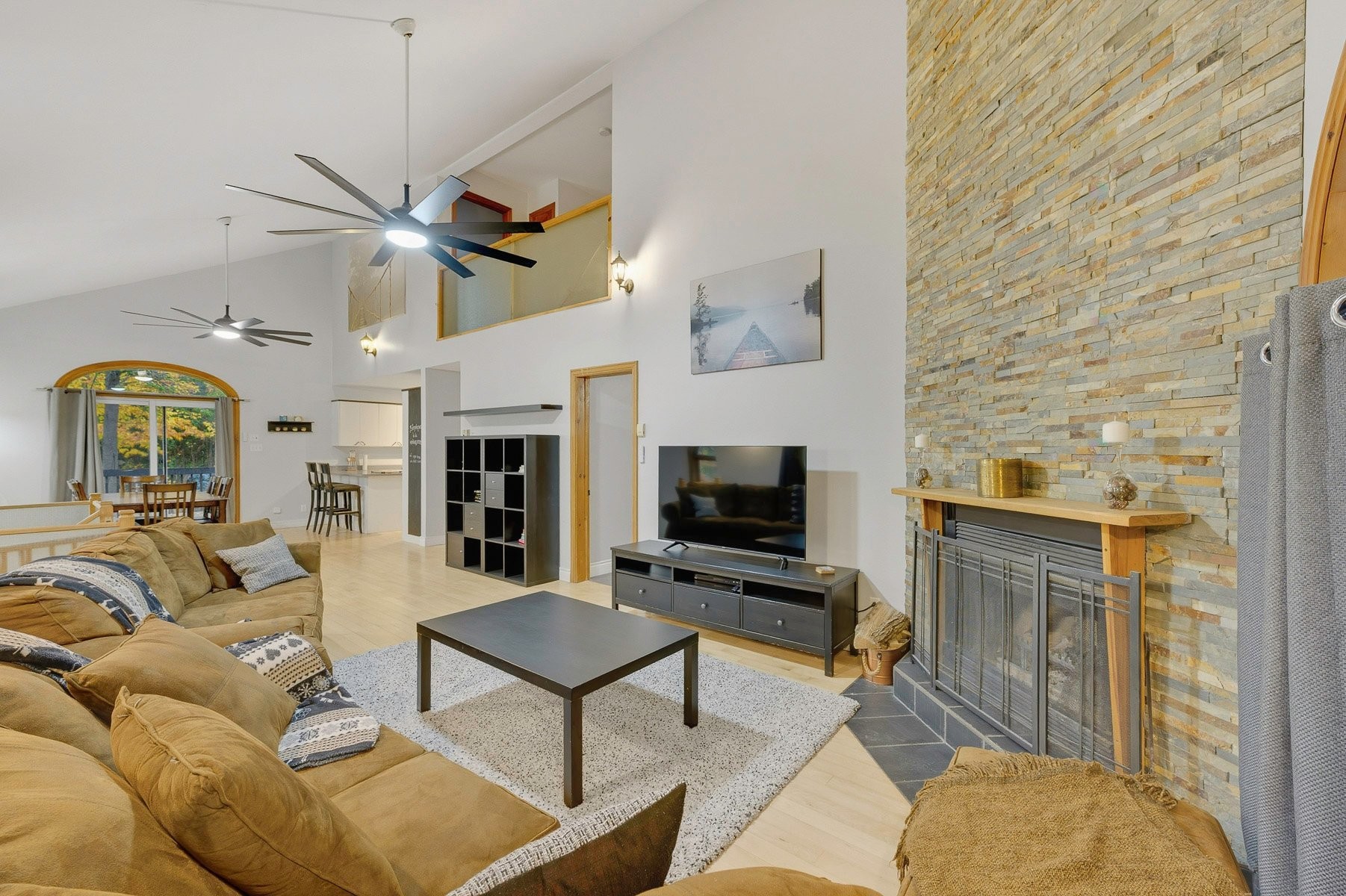 Living Room - 870A Rue De L'Olympiade, Sainte-Adèle, QC - Indoor Photo Showing Living Room With Fireplace