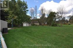 Large mostly fenced back yard -