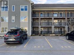 Owned parking space steps from front door -