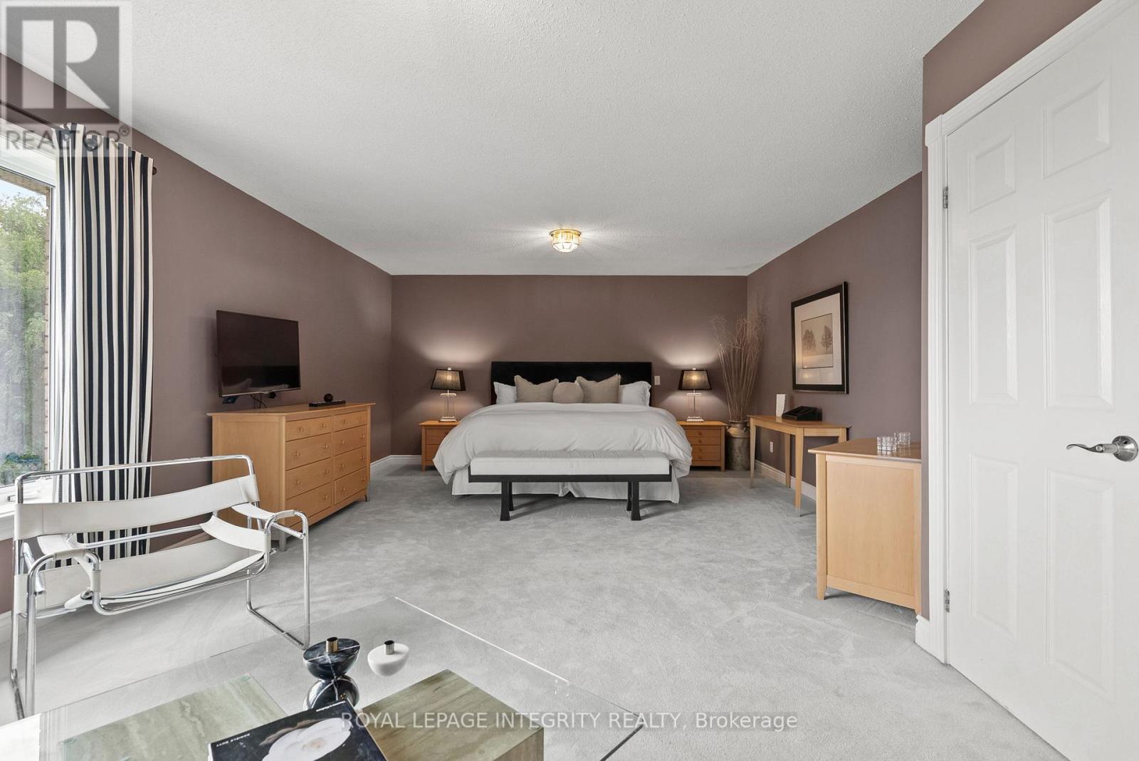 Large Primary Bedroom with Sitting Room & WIC - 6 Marchbrook Circle, Ottawa, ON - Indoor Photo Showing Bedroom