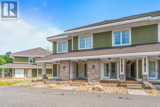 B#206 - 1869 Muskoka Road 118 Highway W, Muskoka Lakes (Monck (Muskoka Lakes)), ON - Outdoor With Deck Patio Veranda With Facade