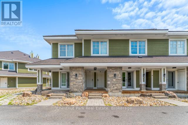 B#206 - 1869 Muskoka Road 118 Highway W, Muskoka Lakes (Monck (Muskoka Lakes)), ON - Outdoor With Deck Patio Veranda With Facade