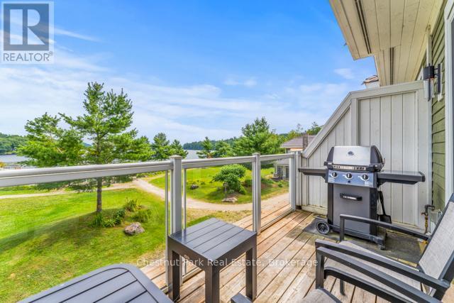 B#206 - 1869 Muskoka Road 118 Highway W, Muskoka Lakes (Monck (Muskoka Lakes)), ON - Outdoor With Deck Patio Veranda With Exterior