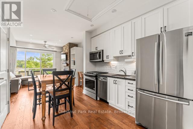 B#206 - 1869 Muskoka Road 118 Highway W, Muskoka Lakes (Monck (Muskoka Lakes)), ON - Indoor Photo Showing Kitchen With Upgraded Kitchen