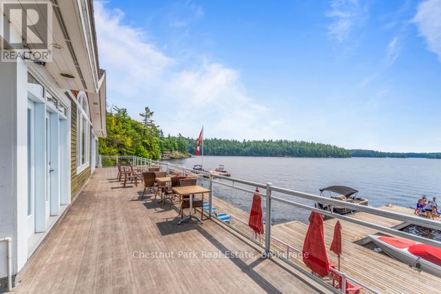 B#206 - 1869 Muskoka Road 118 Highway W, Muskoka Lakes (Monck (Muskoka Lakes)), ON - Outdoor With Body Of Water With View