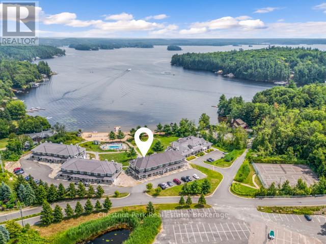 B#206 - 1869 Muskoka Road 118 Highway W, Muskoka Lakes (Monck (Muskoka Lakes)), ON - Outdoor With Body Of Water With View
