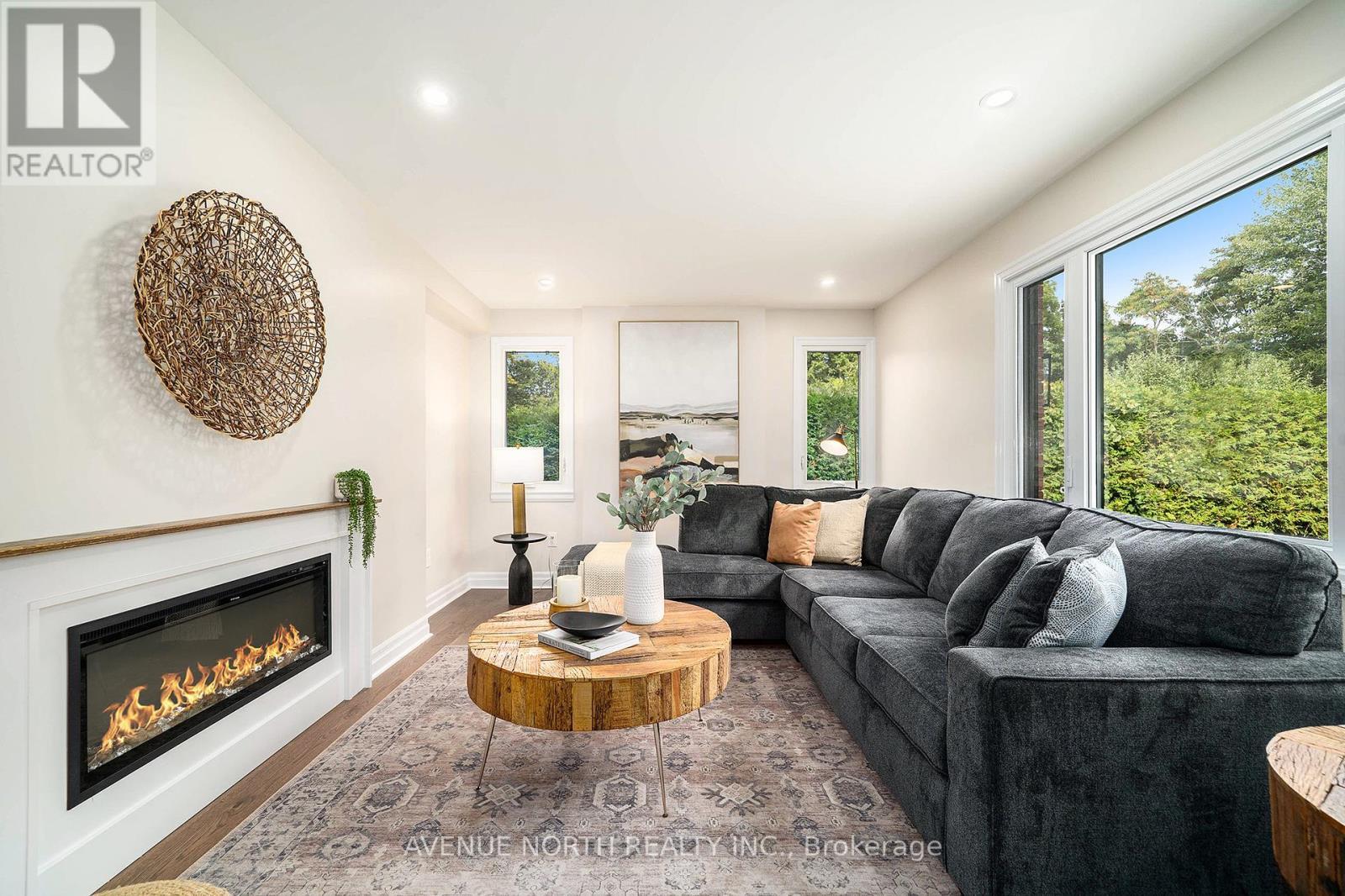 19 Newland Drive, Ottawa, ON - Indoor Photo Showing Living Room With Fireplace