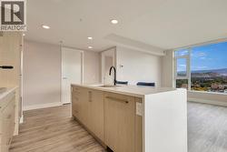 Kitchen/living space with integrated dishwasher -