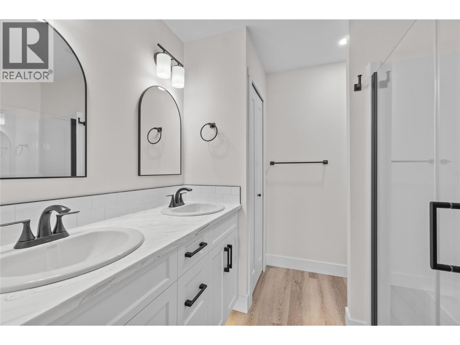 Primary washroom, window, shower, 2 sinks, toe lighting - 730 Elderberry Walk, Sicamous, BC
