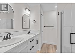 Primary washroom, window, shower, 2 sinks, toe lighting -