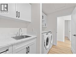 Laundry room, appliances, extra tub, storage -