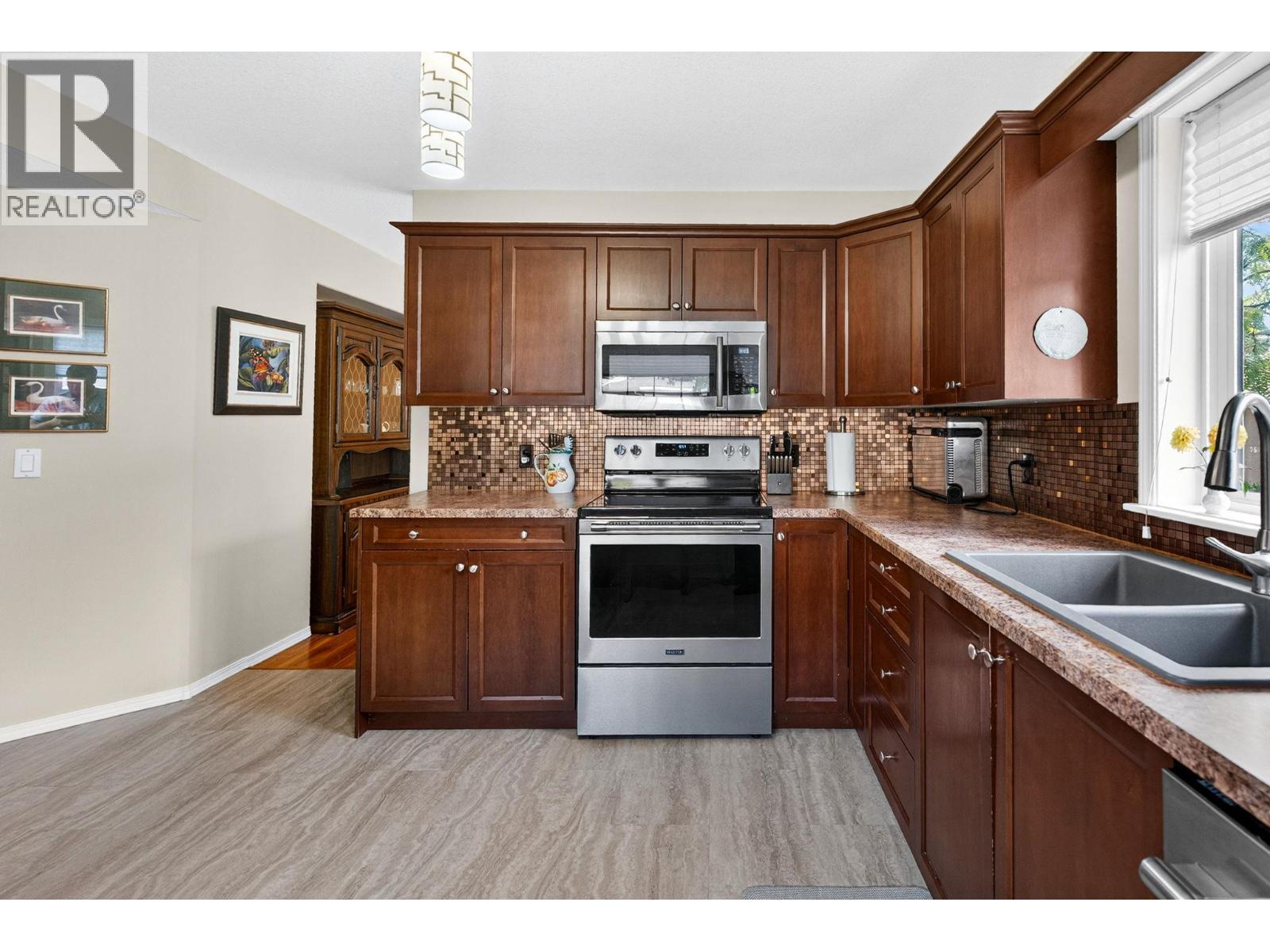 545 Glenmeadows Road Unit# 24, Kelowna, BC - Indoor Photo Showing Kitchen With Stainless Steel Kitchen With Double Sink