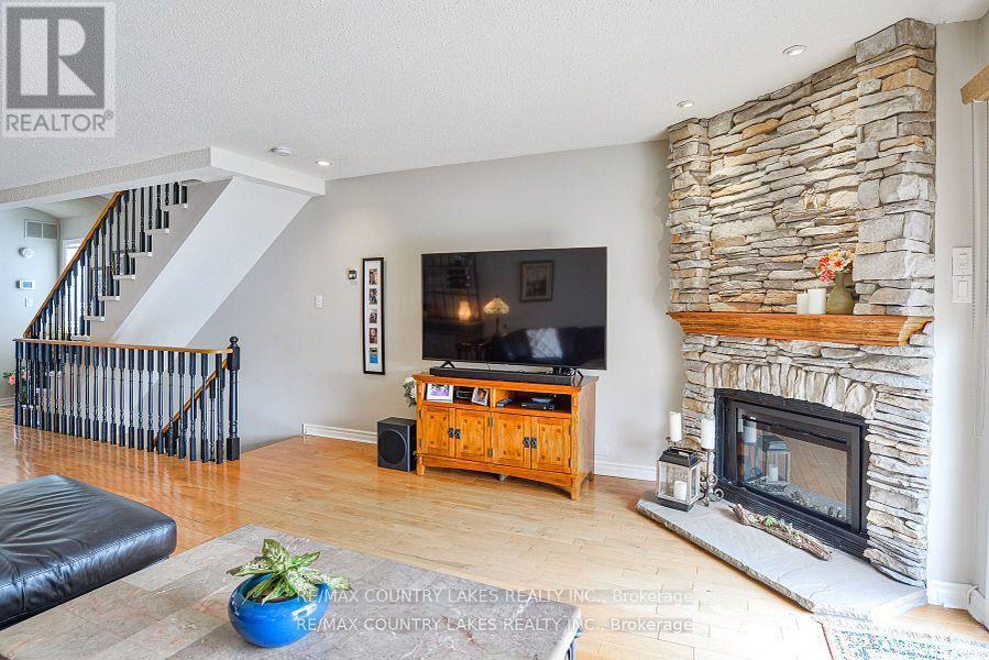 15 - 24 Laguna Parkway, Ramara, ON - Indoor Photo Showing Living Room With Fireplace