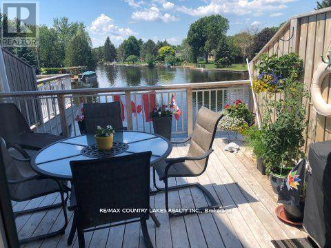15 - 24 Laguna Parkway, Ramara, ON - Outdoor With Body Of Water With Deck Patio Veranda