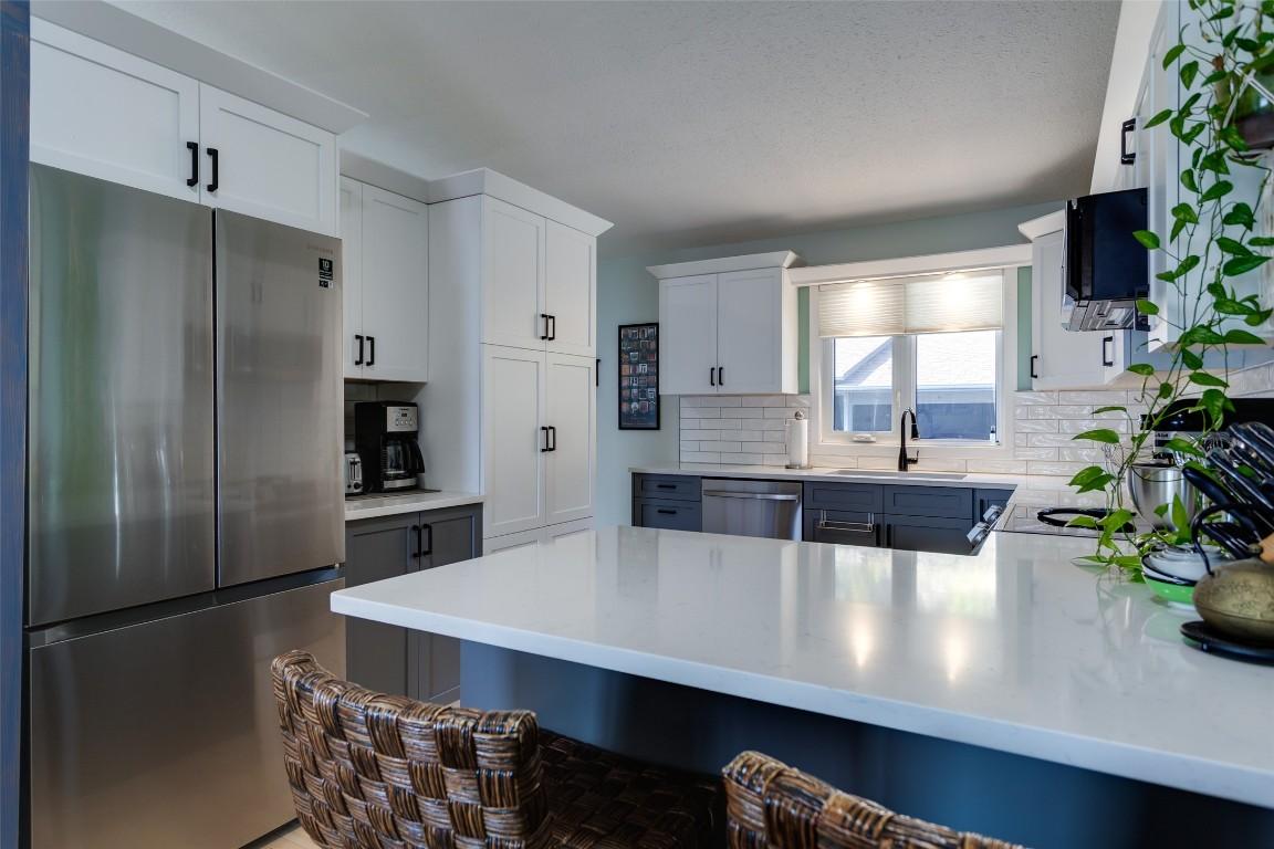 104-5970 Princess Street, Peachland, BC - Indoor Photo Showing Kitchen With Stainless Steel Kitchen With Double Sink With Upgraded Kitchen