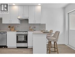 Kitchen Bar Seating- Photos are of a similar home; some features may vary -