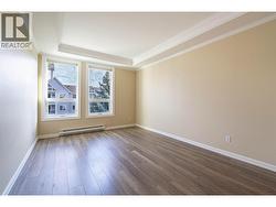Primary Bedroom high ceilings, and seamless vinyl plank flooring -